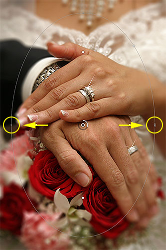 Dragging the side point to resize the 100% line for the blur effect. Image © 2012 Photoshop Essentials.com