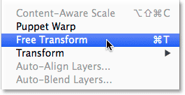 Selecting the Free Transform command from the Edit menu. Image © 2014 Photoshop Essentials.com