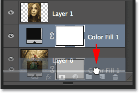 Dragging the Solid Color Fill layer below Layer 0 in the Layers panel. Image © 2014 Photoshop Essentials.com