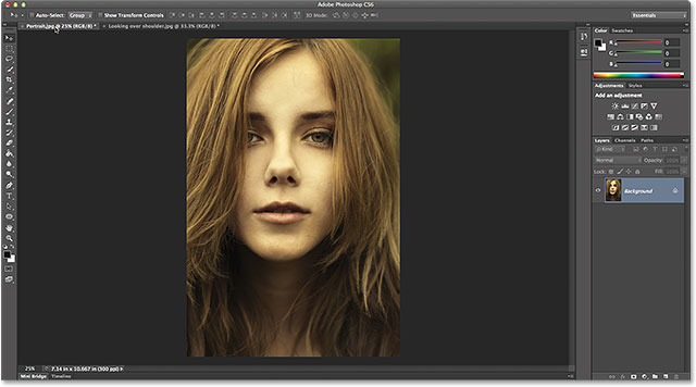 Making the portrait-oriented photo active by clicking its name tab. Image © 2014 Photoshop Essentials.com
