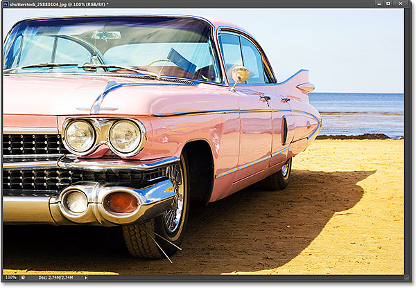 Classic pink car at beach. Photo licensed from Shutterstock by Photoshop Essentials.com