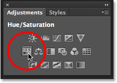 Selecting a Hue/Saturation adjustment layer from the Adjustments panel. Image © 2013 Photoshop Essentials.com