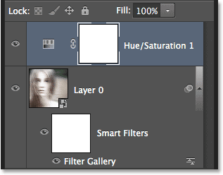 The Layers panel showing the new Hue/Saturation adjustment layer. Image © 2013 Photoshop Essentials.com