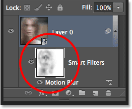 The Smart Filter mask thumbnail showing the areas that were painted over with black. Image © 2013 Photoshop Essentials.com