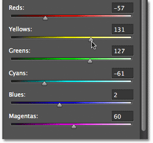Dragging the color siders for the Black & White adjustment layer. Image © 2012 Photoshop Essentials.com.