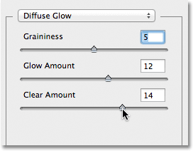 The Graininess, Glow Amount and Clear Amount sliders for the Diffuse Glow filter. Image © 2012 Photoshop Essentials.com.