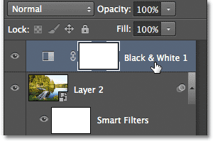 Selecting the Black & White adjustment layer in the Layers panel. Image © 2012 Photoshop Essentials.com.