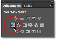 Selecting Hue/Saturation from the Adjustments panel. Image © 2012 Photoshop Essentials.com
