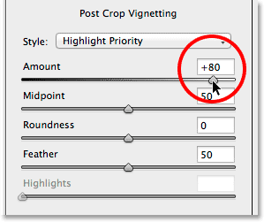 The Amount slider in the Post Crop Vignetting section of the Effects panel. Image © 2014 Photoshop Essentials.com