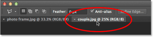 Switching between images in Photoshop by clicking the document tabs. Image © 2014 Photoshop Essentials.com.