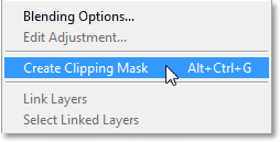 Choosing the Create Clipping Mask command. Image © 2013 Photoshop Essentials.com