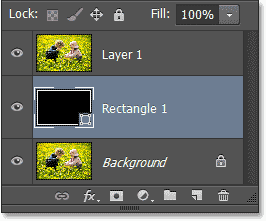 The Shape layer has been moved between the original two layers. Image © 2013 Photoshop Essentials.com