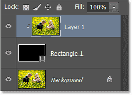 The Layers panel showing Layer 1 clipped to the Shape layer. Image © 2013 Photoshop Essentials.com