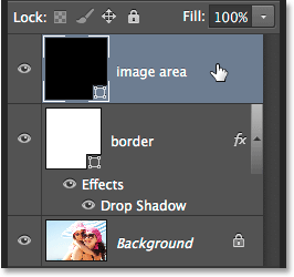 Selecting the image area layer in the Layers panel. Image © 2014 Photoshop Essentials.com