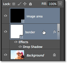 Selecting both shape layers in the Layers panel. Image © 2014 Photoshop Essentials.com