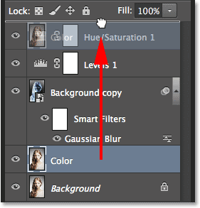 Dragging the Color layer above the other layers in the Layers panel. Image © 2014 Photoshop Essentials.com
