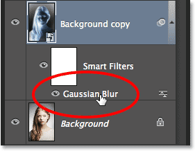 The Layers panel showing the Gaussian Blur Smart Filter below the Smart Object. Image © 2014 Photoshop Essentials.com