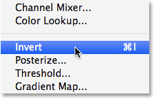 Selecting the Invert command from under the Image menu in Photoshop. Image © 2014 Photoshop Essentials.com
