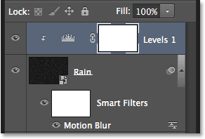 The Layers panel showing the Levels adjustment layer. Image © 2013 Photoshop Essentials.com