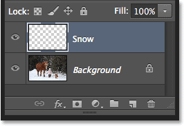 The Layers panel showing the new Snow layer above the Background layer. Image © 2013 Photoshop Essentials.com