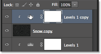 Selecting the copy of the Levels adjustment layer in the Layers panel. Image © 2013 Photoshop Essentials.com