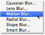 Selecting the Motion Blur filter from the Filter menu in Photoshop. Image © 2013 Photoshop Essentials.com