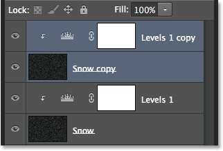 The Layers panel showing the copies of the Snow and Levels adjustment layer. Image © 2013 Photoshop Essentials.com