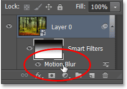 Double-clicking the Motion Blur Smart Filter in the Layers panel. Image © 2013 Photoshop Essentials.com