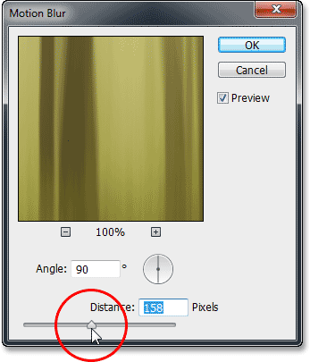 Increasing the Distance value in the Motion Blur dialog box. Image © 2013 Photoshop Essentials.com