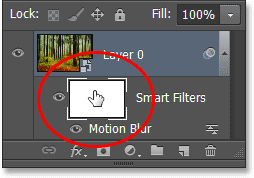 Selecting the Smart Filter layer mask in the Layers panel. Image © 2013 Photoshop Essentials.com