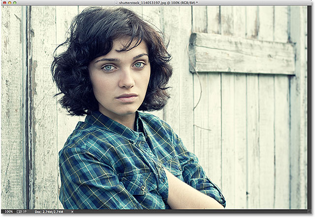 serious girl looks at you with sadness in her eyes. Image licensed from Shutterstock by Photoshop Essentials.com