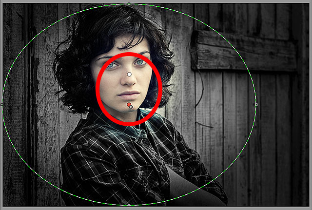 Switching between Radial Filters by clicking on their dots. Image © 2013 Photoshop Essentials.com