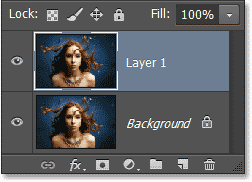 Layer 1 appears in the Layers panel above the Background layer. Image © 2013 Photoshop Essentials.com