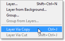 Selecting the New Layer Via Copy command from the Layer menu in Photoshop CS6. Image © 2013 Photoshop Essentials.com