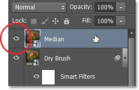 Selecting and turning on the Median layer in the Layers panel. Image © 2013 Photoshop Essentials.com
