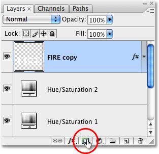 Clicking the Layer Mask icon in the Layers palette in Photoshop. Image © 2009 Photoshop Essentials.com.