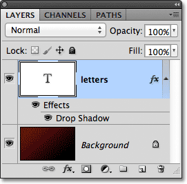 The Layers panel in Photoshop showing the text layer and the Background layer. Image © 2011 Photoshop Essentials.com.