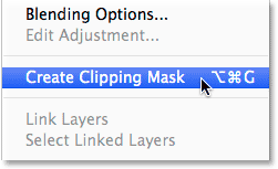 Selecting Create Clipping Mask from the Layers panel menu. 