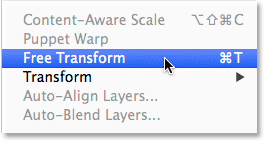 Selecting the Free Transform command from the Edit menu in Photoshop. 