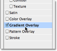 Selecting the Gradient Overlay layer style. Image © 2010 Photoshop Essentials.com.