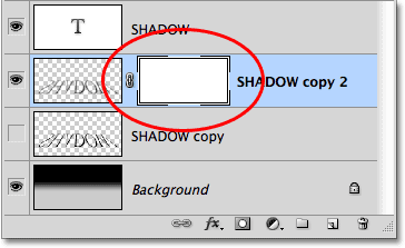 A layer mask thumbnail appears on the shadow layer. Image © 2010 Photoshop Essentials.com.