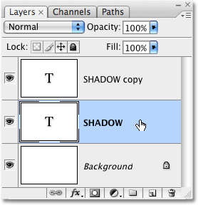Selecting the original text layer in Photoshop. Image © 2009 Photoshop Essentials.com