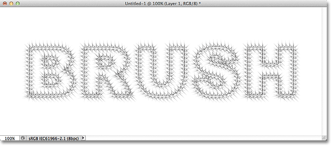 A stroke applied to a text path using the Starburst - Large brush in Photoshop. Image © 2011 Photoshop Essentials.com