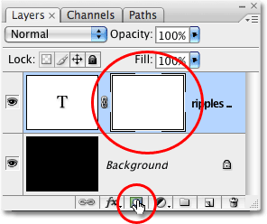 Adding a layer mask to the type layer in Photoshop. Image © 2009 Photoshop Essentials.com.